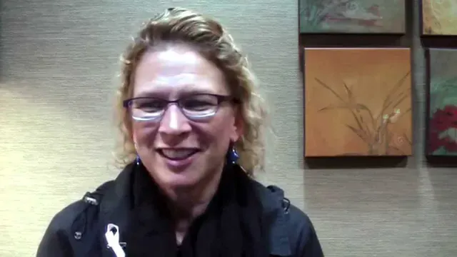 A Cooley Smiles patient speaking to camera in the practice consultation room.