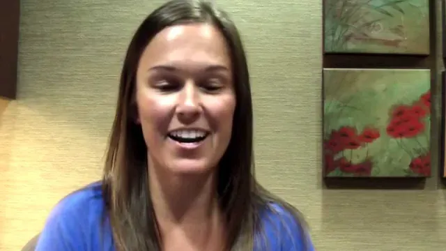 A Cooley Smiles patient speaking to camera in the practice consultation room.